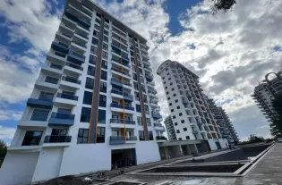 Апартаменты 1+1 с видом на море и горы в новом ЖК района Махмутлар
