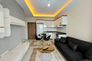 Светлая и просторная двухкомнатная квартира в районе Махмутлар