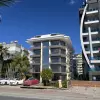 Жилой комплекс с апартаментами популярных планировок на первой береговой линии в Махмутларе